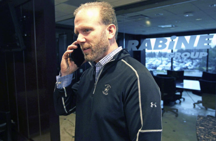 Gary Rabine, the Founder of Rabine Paving, making a phonecall